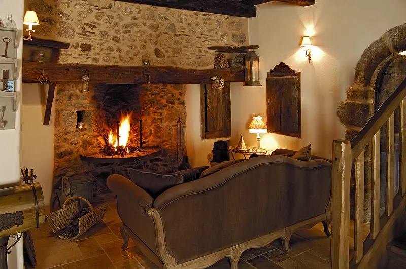 L'Oustal, the living room by the fireplace